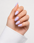 Hand with lavender nail polish on a white background