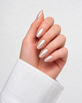 Hand with light pink nail polish on a white background